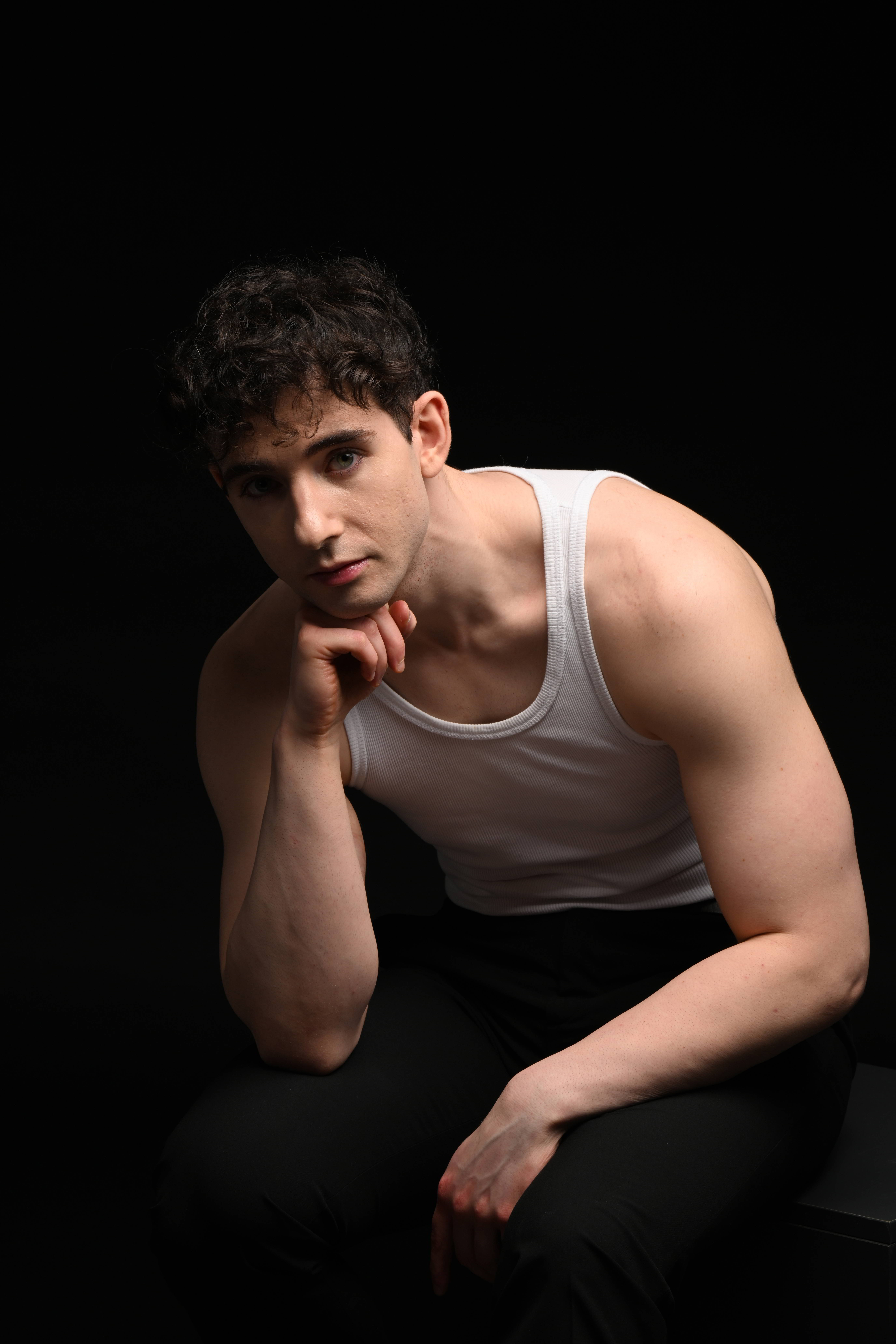 Studio — white tank seated forward